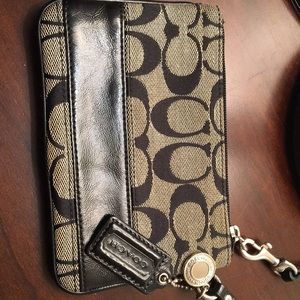 Black classic C Coach wristlet.